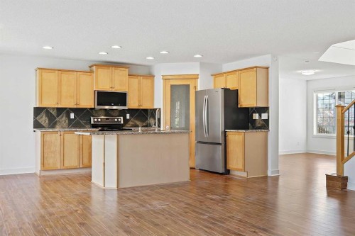 7936 Springbank Boulevard Sw, Calgary, AB - Indoor Photo Showing Kitchen With Stainless Steel Kitchen