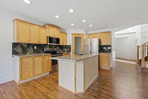 7936 Springbank Boulevard Sw, Calgary, AB - Indoor Photo Showing Kitchen With Stainless Steel Kitchen