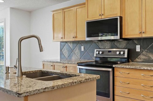 7936 Springbank Boulevard Sw, Calgary, AB - Indoor Photo Showing Kitchen With Double Sink With Upgraded Kitchen