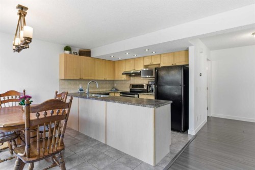 74 Evansbrooke Way Nw, Calgary, AB - Indoor Photo Showing Kitchen With Double Sink