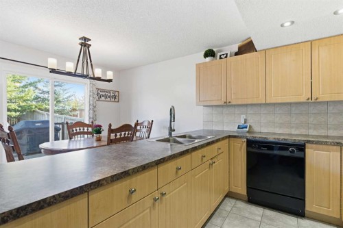 74 Evansbrooke Way Nw, Calgary, AB - Indoor Photo Showing Kitchen With Double Sink
