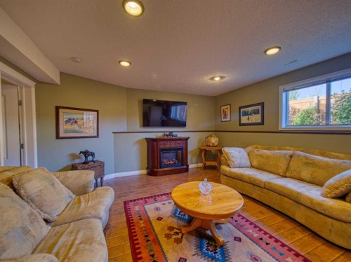 239 Sagewood Drive, Airdrie, AB - Indoor Photo Showing Living Room With Fireplace