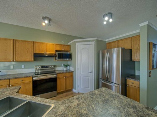 239 Sagewood Drive, Airdrie, AB - Indoor Photo Showing Kitchen
