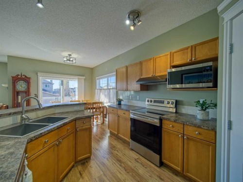 239 Sagewood Drive, Airdrie, AB - Indoor Photo Showing Kitchen With Double Sink