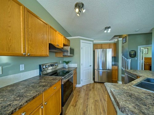 239 Sagewood Drive, Airdrie, AB - Indoor Photo Showing Kitchen With Double Sink