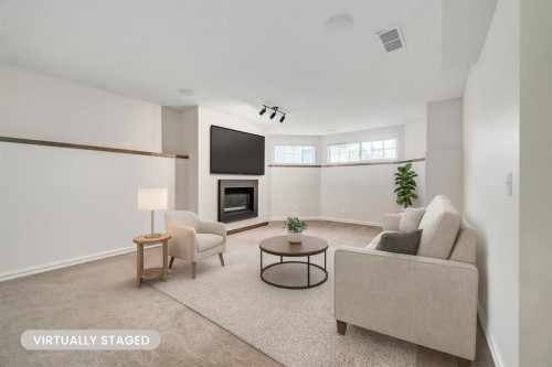 222 Diamond Court Se, Calgary, AB - Indoor Photo Showing Other Room With Fireplace