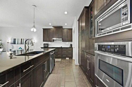 129 Springbluff Boulevard Sw, Calgary, AB - Indoor Photo Showing Kitchen With Double Sink With Upgraded Kitchen