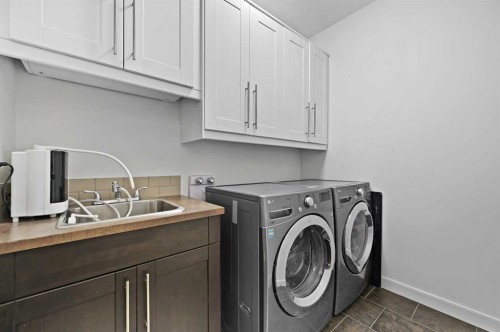 129 Springbluff Boulevard Sw, Calgary, AB - Indoor Photo Showing Laundry Room