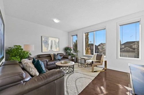 129 Springbluff Boulevard Sw, Calgary, AB - Indoor Photo Showing Living Room