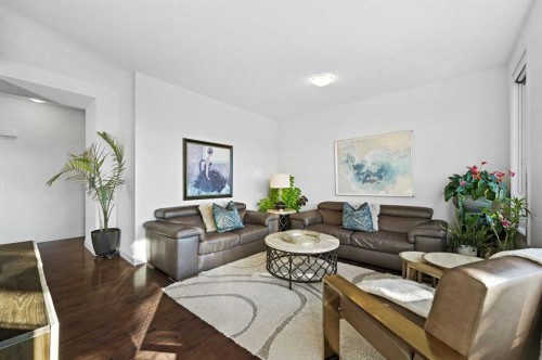 129 Springbluff Boulevard Sw, Calgary, AB - Indoor Photo Showing Living Room