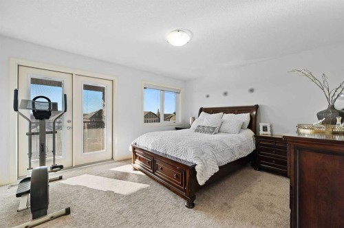 129 Springbluff Boulevard Sw, Calgary, AB - Indoor Photo Showing Bedroom