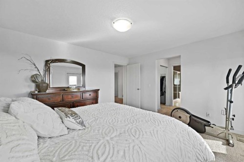 129 Springbluff Boulevard Sw, Calgary, AB - Indoor Photo Showing Bedroom