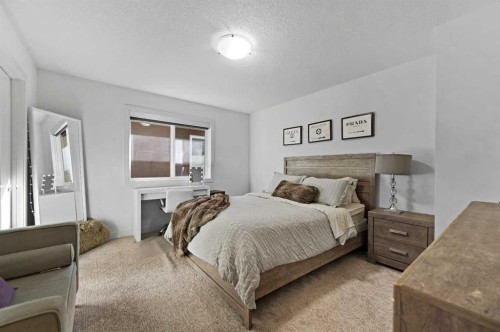 129 Springbluff Boulevard Sw, Calgary, AB - Indoor Photo Showing Bedroom