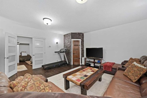 129 Springbluff Boulevard Sw, Calgary, AB - Indoor Photo Showing Living Room
