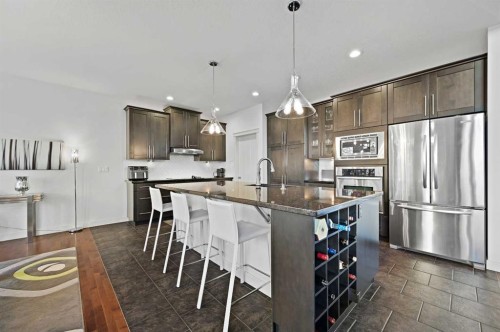 129 Springbluff Boulevard Sw, Calgary, AB - Indoor Photo Showing Kitchen With Upgraded Kitchen