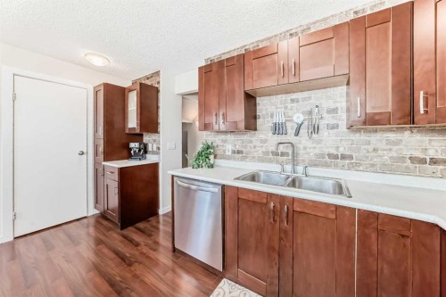 56 Applecroft Road Se, Calgary, AB - Indoor Photo Showing Kitchen With Double Sink