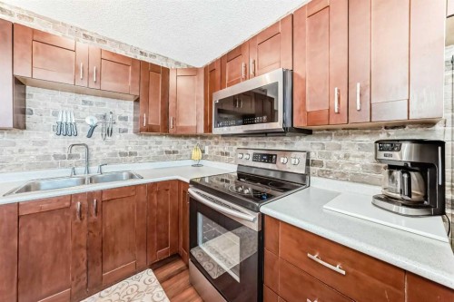 56 Applecroft Road Se, Calgary, AB - Indoor Photo Showing Kitchen With Double Sink