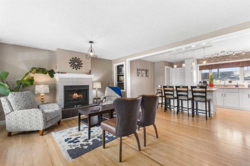 8516 Addison Drive Se, Calgary, AB - Indoor Photo Showing Living Room With Fireplace