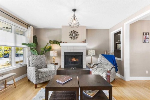 8516 Addison Drive Se, Calgary, AB - Indoor Photo Showing Living Room With Fireplace
