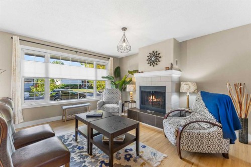 8516 Addison Drive Se, Calgary, AB - Indoor Photo Showing Living Room With Fireplace
