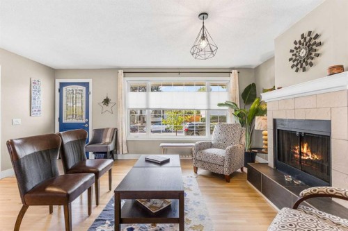 8516 Addison Drive Se, Calgary, AB - Indoor Photo Showing Living Room With Fireplace