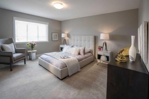 72 Sunrise Heath, Cochrane, AB - Indoor Photo Showing Bedroom