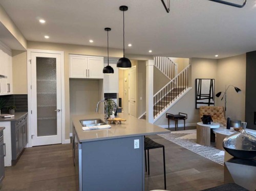 72 Sunrise Heath, Cochrane, AB - Indoor Photo Showing Kitchen With Double Sink