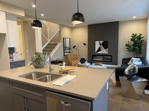 72 Sunrise Heath, Cochrane, AB - Indoor Photo Showing Kitchen With Double Sink