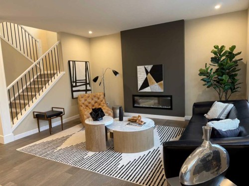 72 Sunrise Heath, Cochrane, AB - Indoor With Fireplace