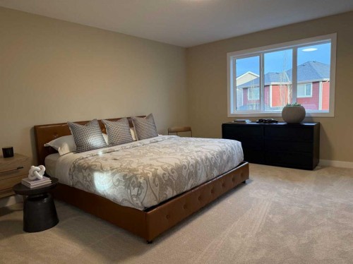 72 Sunrise Heath, Cochrane, AB - Indoor Photo Showing Bedroom
