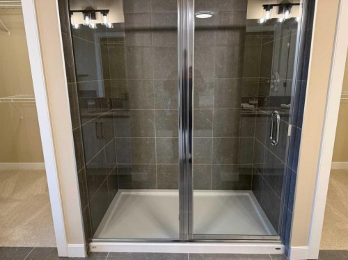 72 Sunrise Heath, Cochrane, AB - Indoor Photo Showing Bathroom
