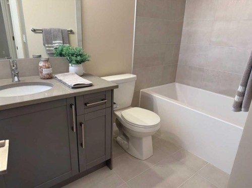 72 Sunrise Heath, Cochrane, AB - Indoor Photo Showing Bathroom