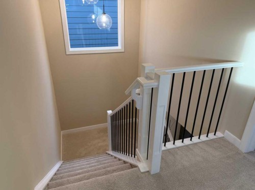 72 Sunrise Heath, Cochrane, AB - Indoor Photo Showing Other Room