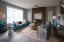 72 Sunrise Heath, Cochrane, AB  - Indoor Photo Showing Living Room With Fireplace 