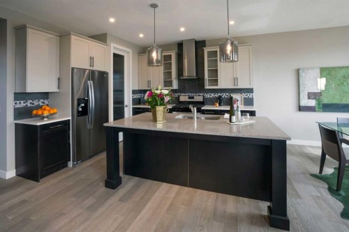 72 Sunrise Heath, Cochrane, AB - Indoor Photo Showing Kitchen With Upgraded Kitchen