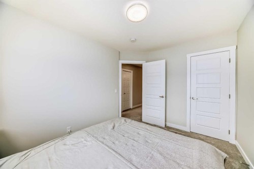 934 Cobblemore Common Sw, Airdrie, AB - Indoor Photo Showing Bedroom