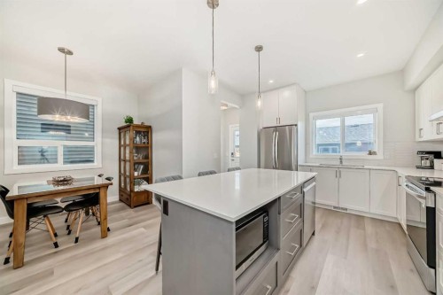 934 Cobblemore Common Sw, Airdrie, AB - Indoor Photo Showing Kitchen With Stainless Steel Kitchen With Upgraded Kitchen