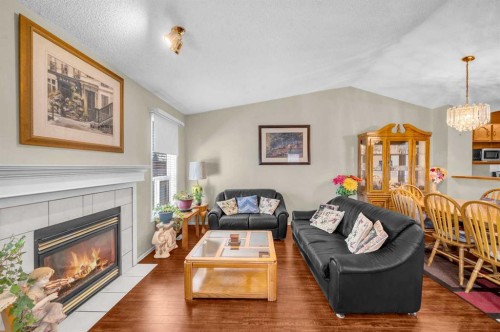 65 Tararidge Circle Ne, Calgary, AB - Indoor Photo Showing Living Room With Fireplace