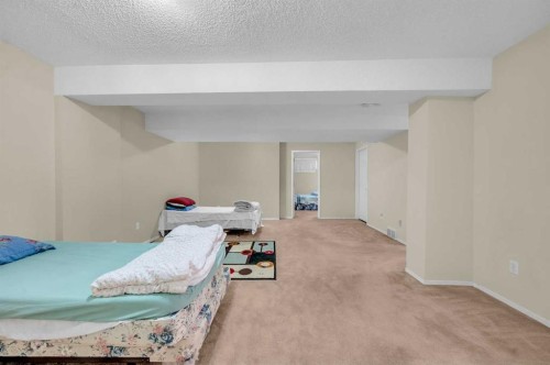 65 Tararidge Circle Ne, Calgary, AB - Indoor Photo Showing Bedroom