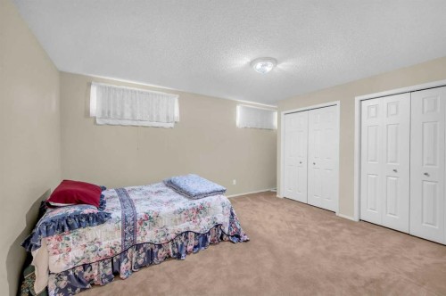 65 Tararidge Circle Ne, Calgary, AB - Indoor Photo Showing Bedroom