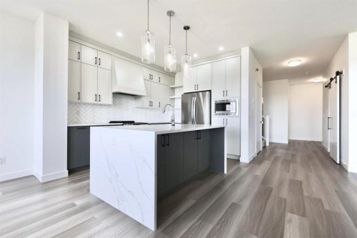 357 Copperhead Way Se, Calgary, AB - Indoor Photo Showing Kitchen With Upgraded Kitchen