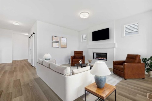 357 Copperhead Way Se, Calgary, AB - Indoor Photo Showing Living Room With Fireplace