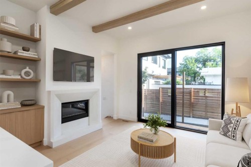 4309 32 Avenue Sw, Calgary, AB - Indoor Photo Showing Living Room With Fireplace