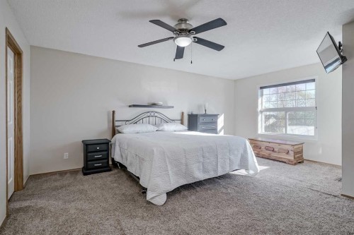 8 Everstone Rise Sw, Calgary, AB - Indoor Photo Showing Bedroom