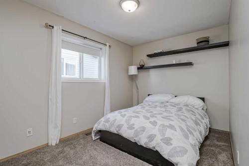 8 Everstone Rise Sw, Calgary, AB - Indoor Photo Showing Bedroom