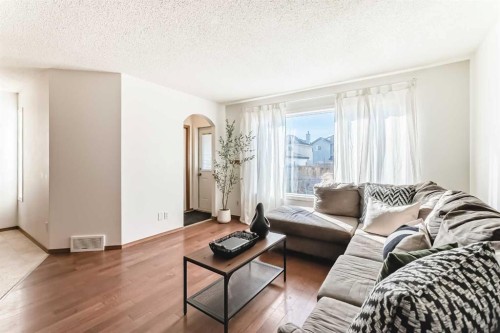 201 Cranberry Square Se, Calgary, AB - Indoor Photo Showing Living Room