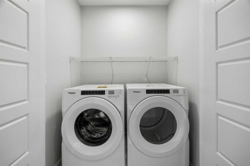 80 Carringvue Place Nw, Calgary, AB - Indoor Photo Showing Laundry Room