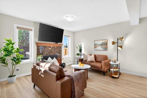 1346 Kings Heights Way Se, Airdrie, AB - Indoor Photo Showing Living Room With Fireplace