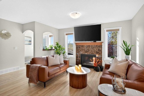 1346 Kings Heights Way Se, Airdrie, AB - Indoor Photo Showing Living Room With Fireplace