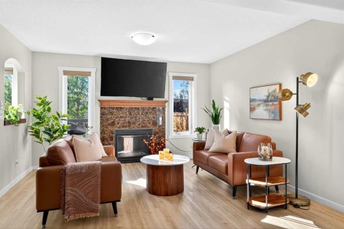 1346 Kings Heights Way Se, Airdrie, AB - Indoor Photo Showing Living Room With Fireplace